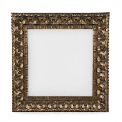 An ornate square wall mirror with a heavily carved, embossed gold frame, mounted on a white paneled wall. The mirror reflects a cluttered room with shelves and framed art.