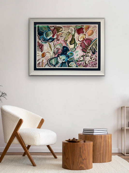 Colourful floral artwork by Amber Gittins in white frame